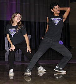 Two students dancing on stage