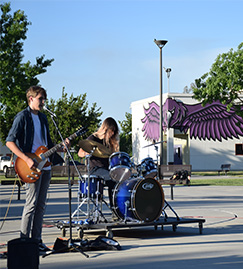 Student band playing in parking lot